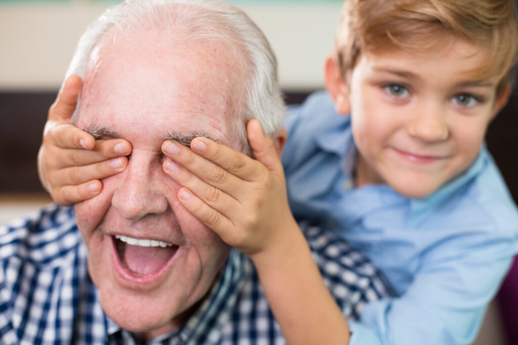 Grandpa playing with his grandchild.